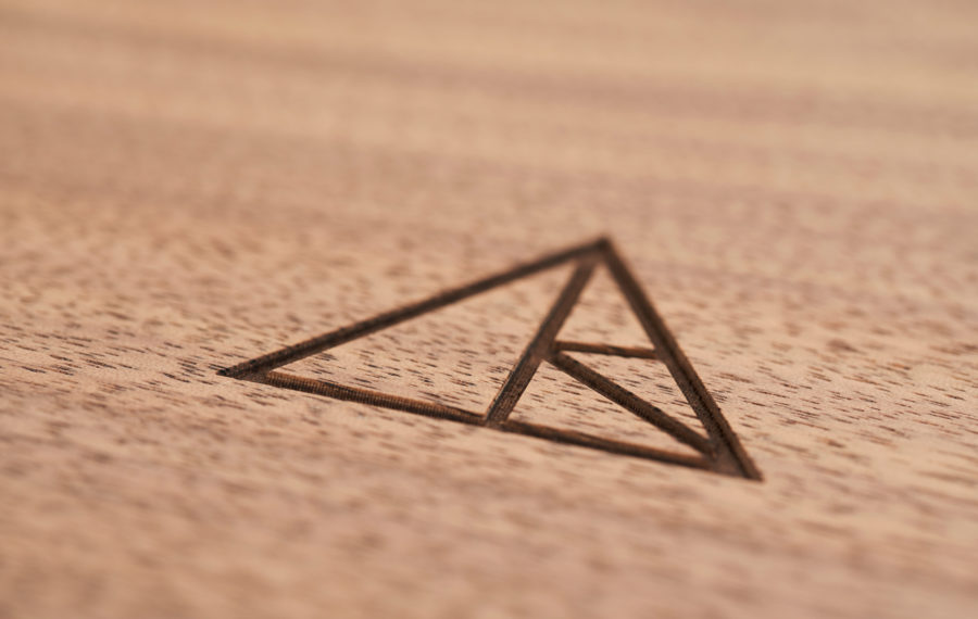 laser-engraved logo on wood